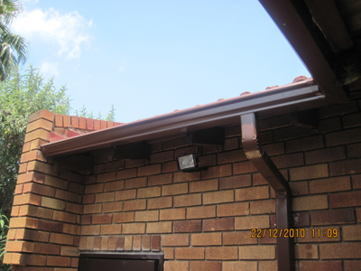 Completed Gutter with Down-pipe in Safari Brown.